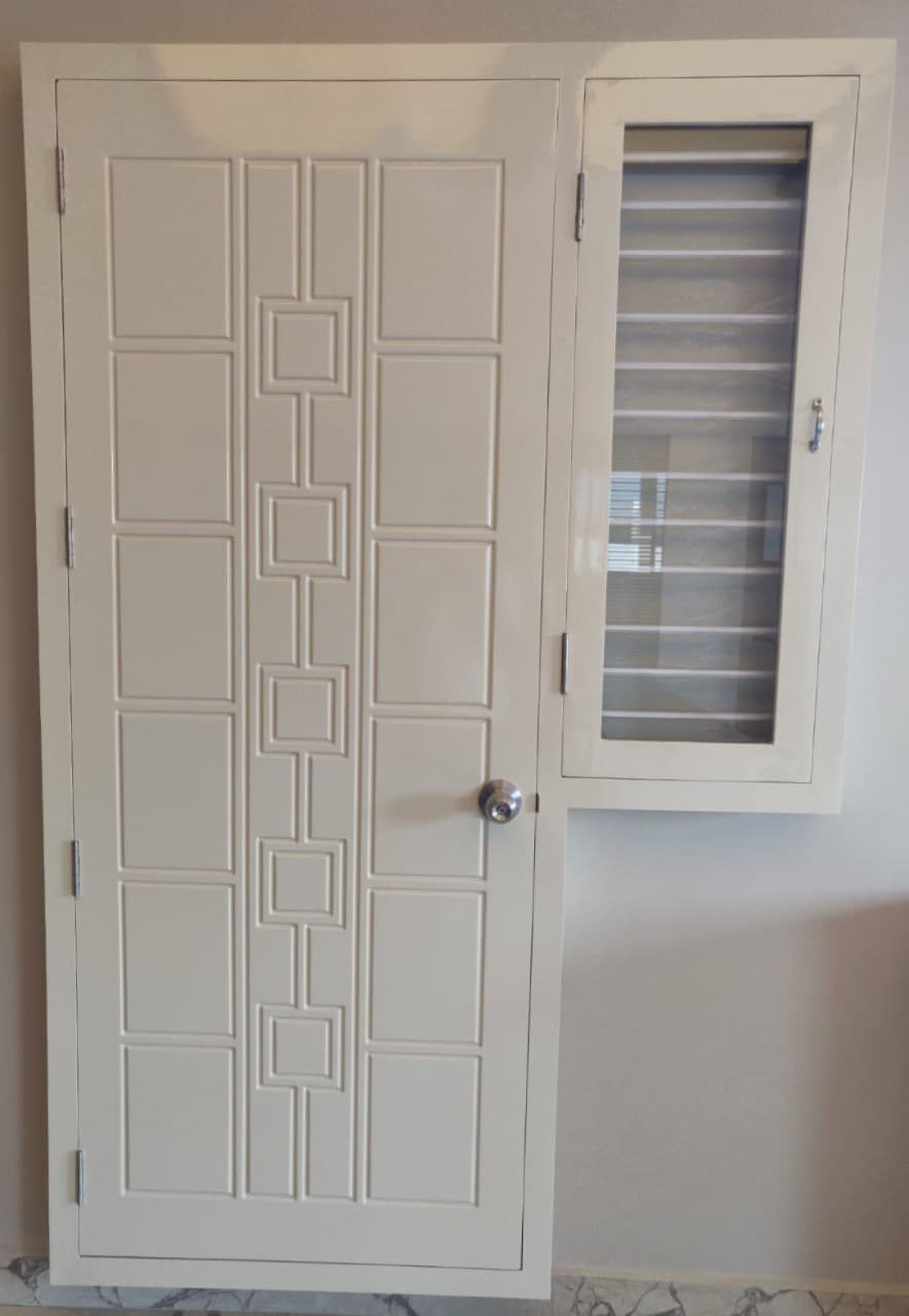 Panelled door shutter finished in cream