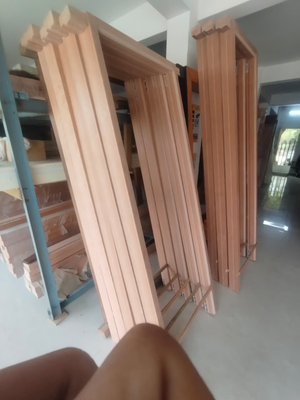 Freshly milled timber door frames stacked in the Vishnu Timber Touch workshop