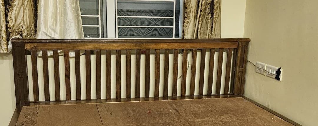Slatted teak headboard on a bed made to order by Vishnu Timber Touch